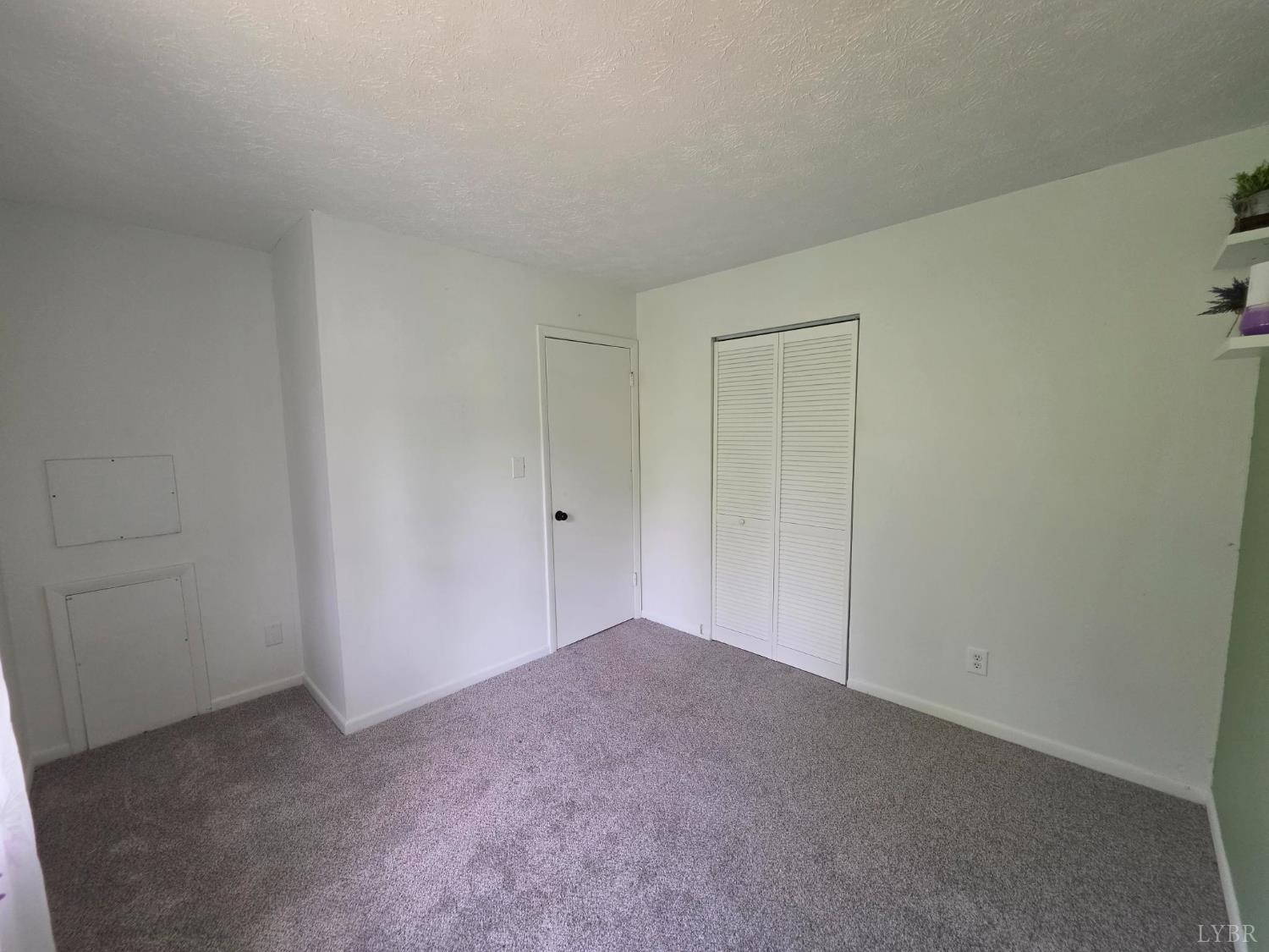 178 Dulwich Drive, Unit 178 Amherst, VA 24521 - Photo 12 of 17 a view of an empty room and entryway