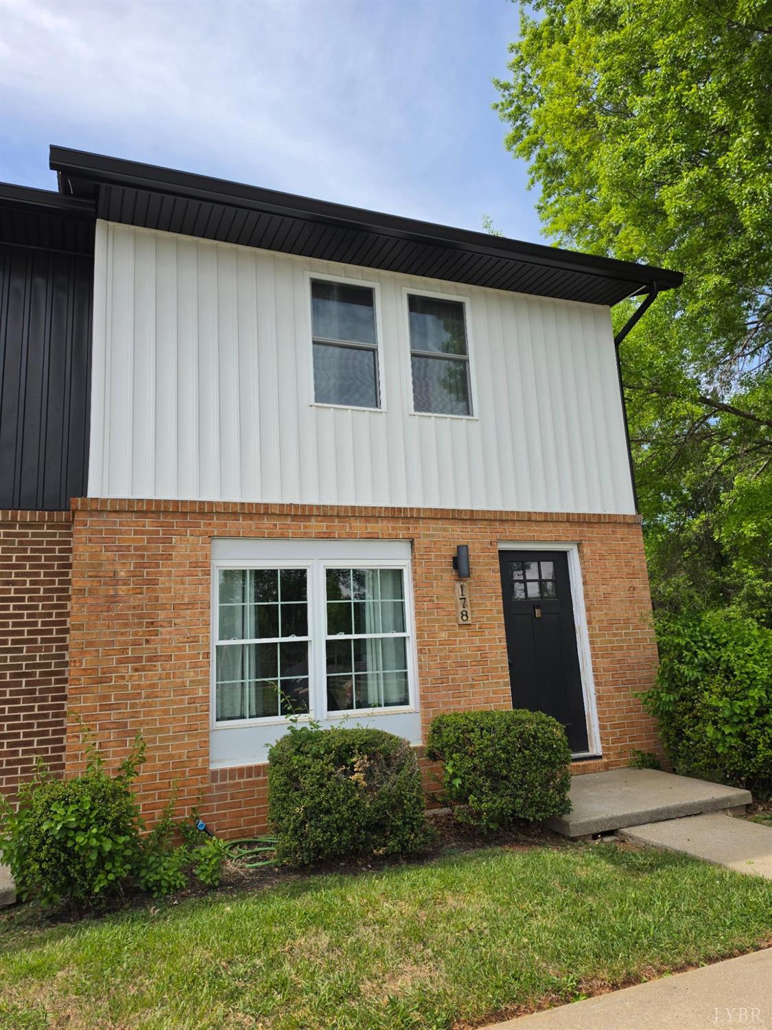 178 Dulwich Drive, Unit 178 Amherst, VA 24521 - Photo 2 of 17 a front view of a house with a yard