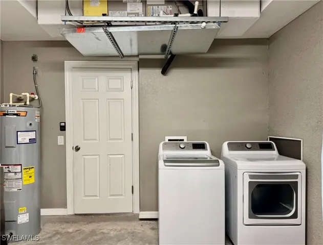 a bedroom with two beds and a chandelier