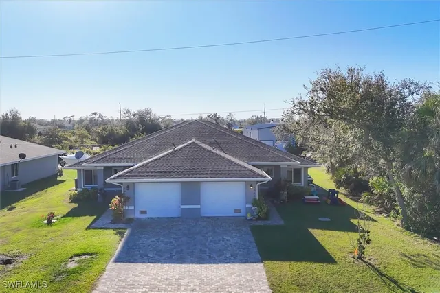 an aerial view of a house with a garden