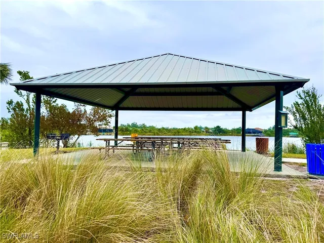 swimming pool with outdoor seating and yard
