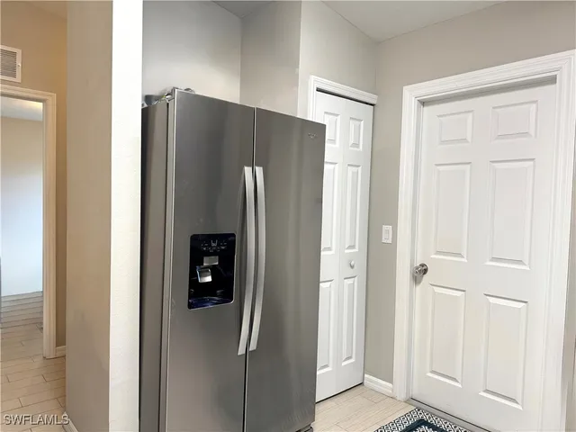 a view of a refrigerator in a kitchen