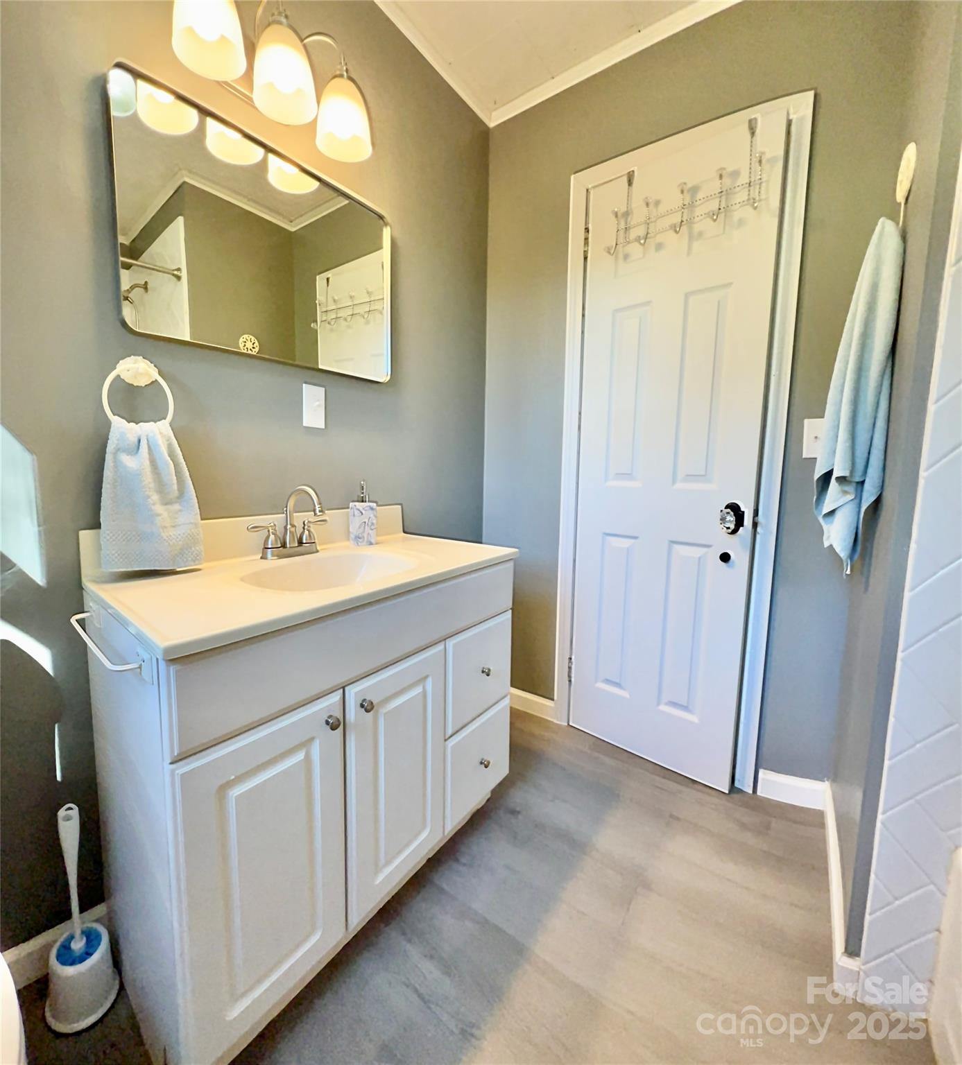 240 Hamrick Road Mooresboro, NC 28114 - Photo 12 of 23 a bathroom with a double vanity sink and mirror