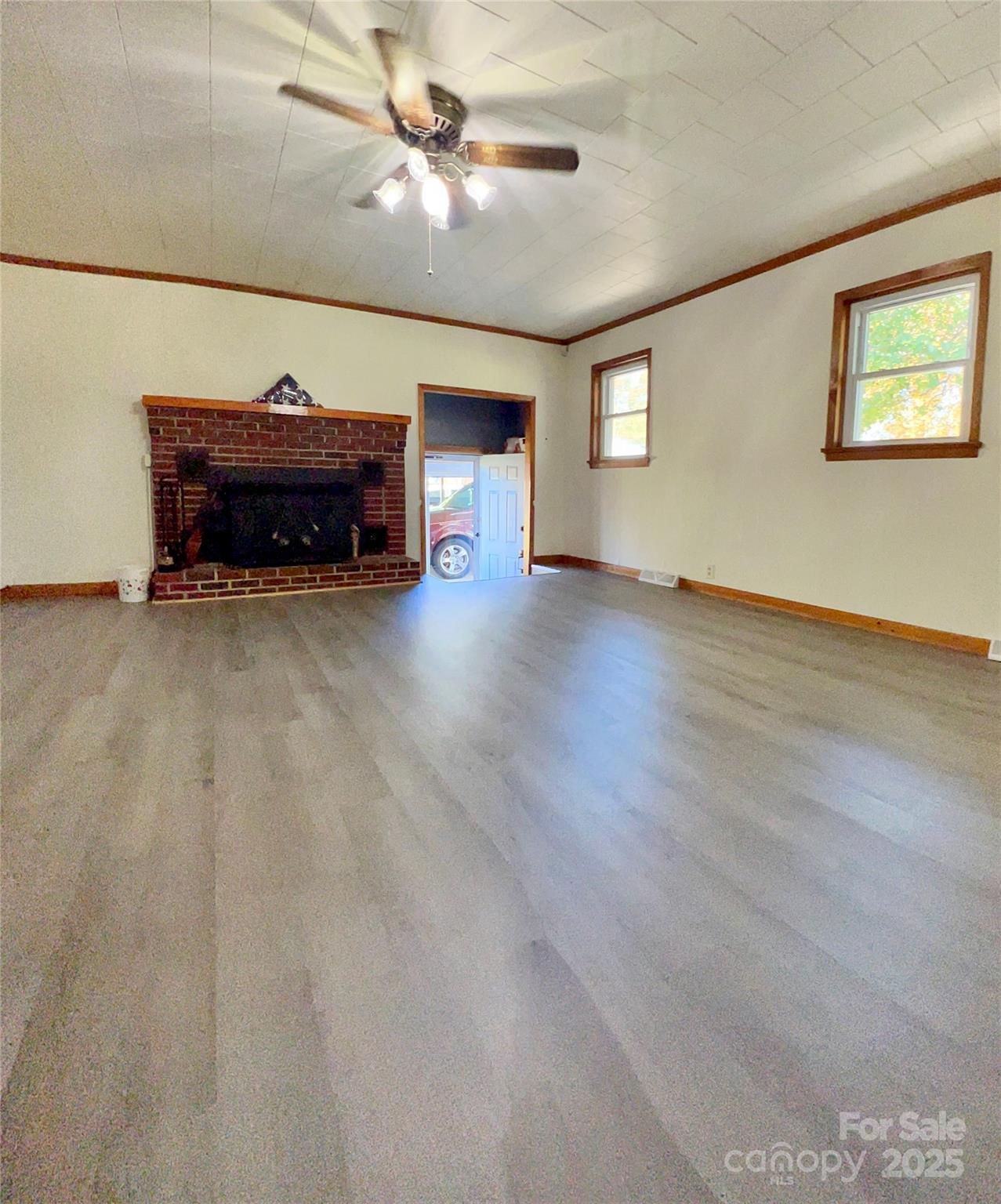 240 Hamrick Road Mooresboro, NC 28114 - Photo 14 of 23 an empty room with windows and ceiling fan