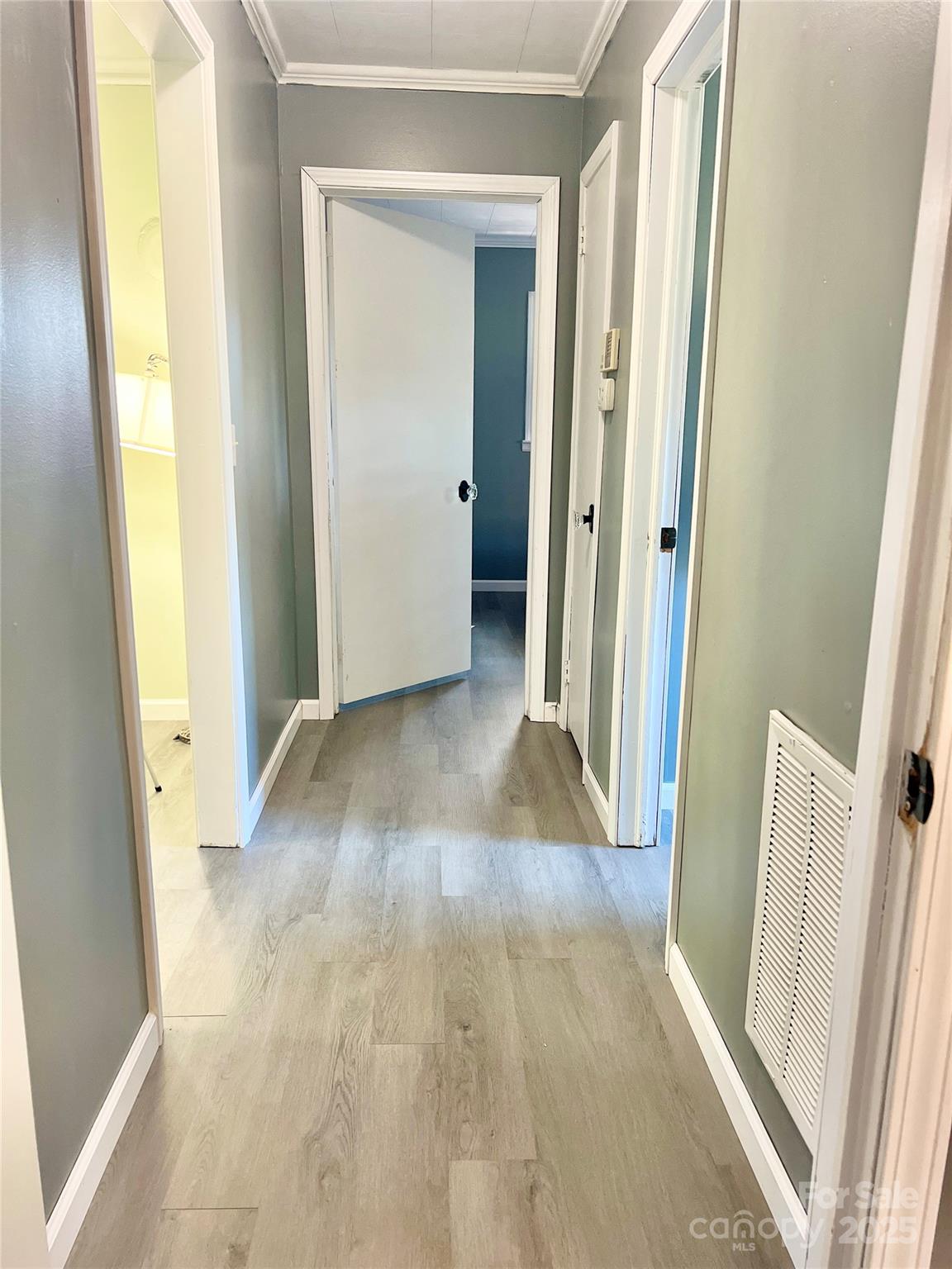 240 Hamrick Road Mooresboro, NC 28114 - Photo 16 of 23 a view of a hallway with wooden floor and door