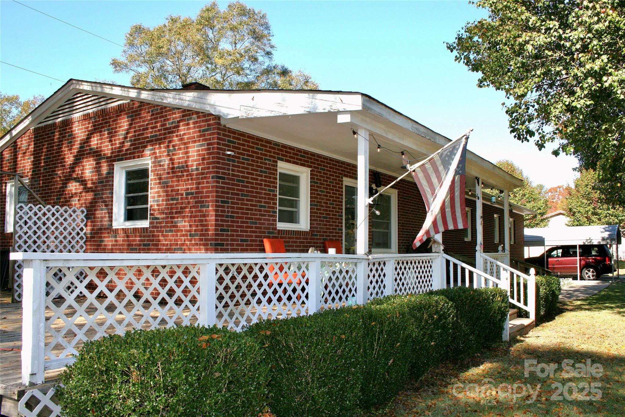 240 Hamrick Road Mooresboro, NC 28114 - Photo 2 of 23 a view of a house with a small yard and wooden fence