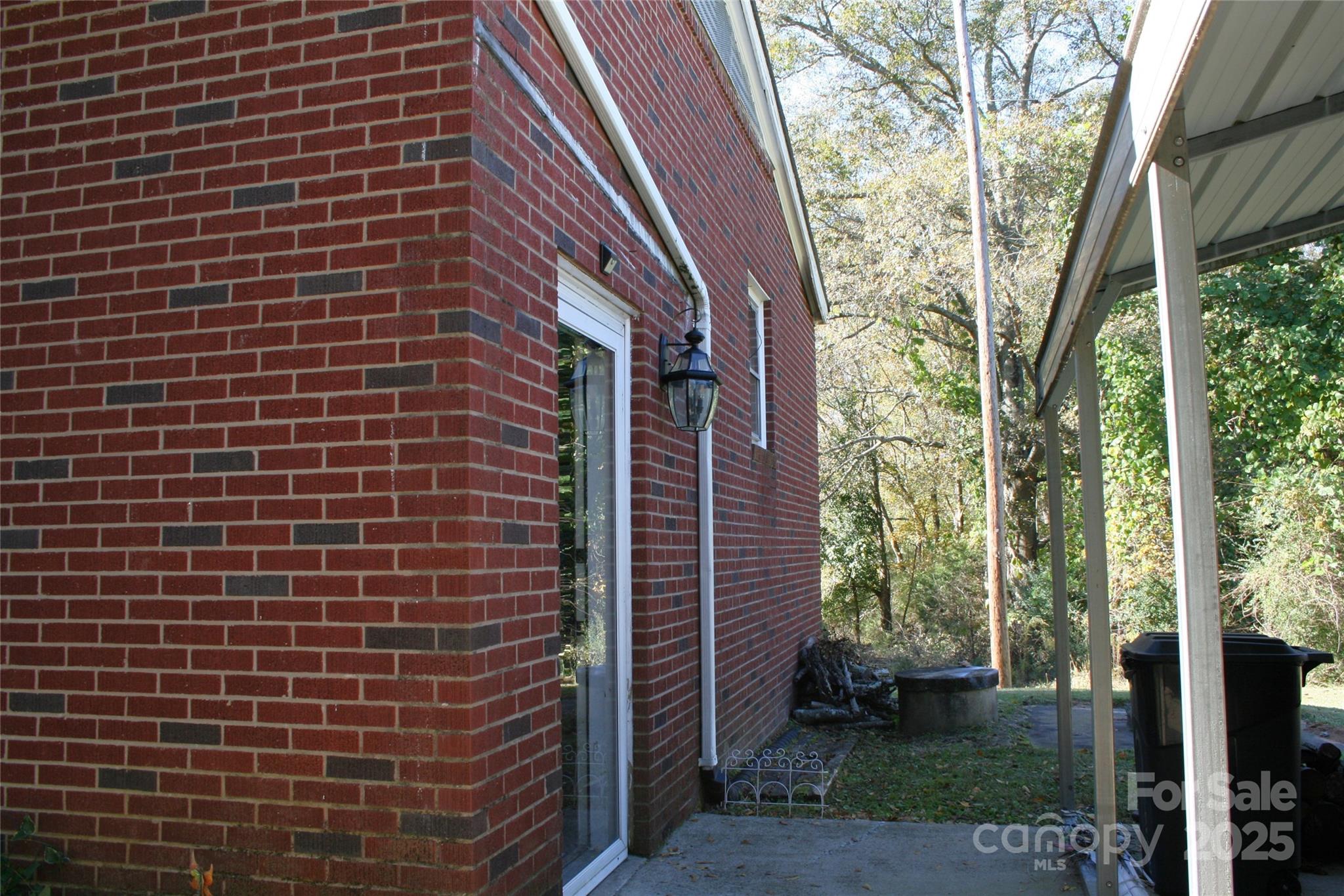 240 Hamrick Road Mooresboro, NC 28114 - Photo 5 of 23 a view of a brick wall