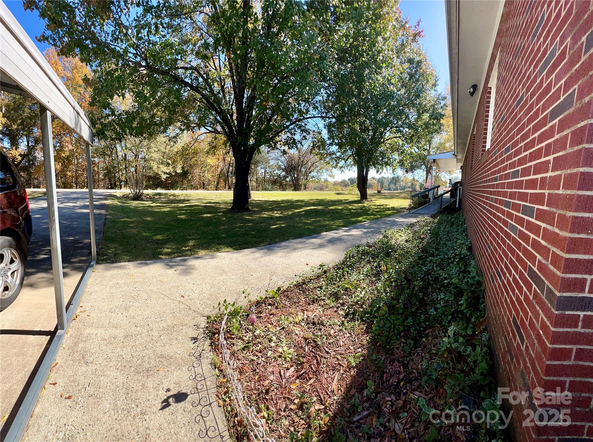 240 Hamrick Road Mooresboro, NC 28114 - Photo 6 of 23 a view of a yard with plants and trees