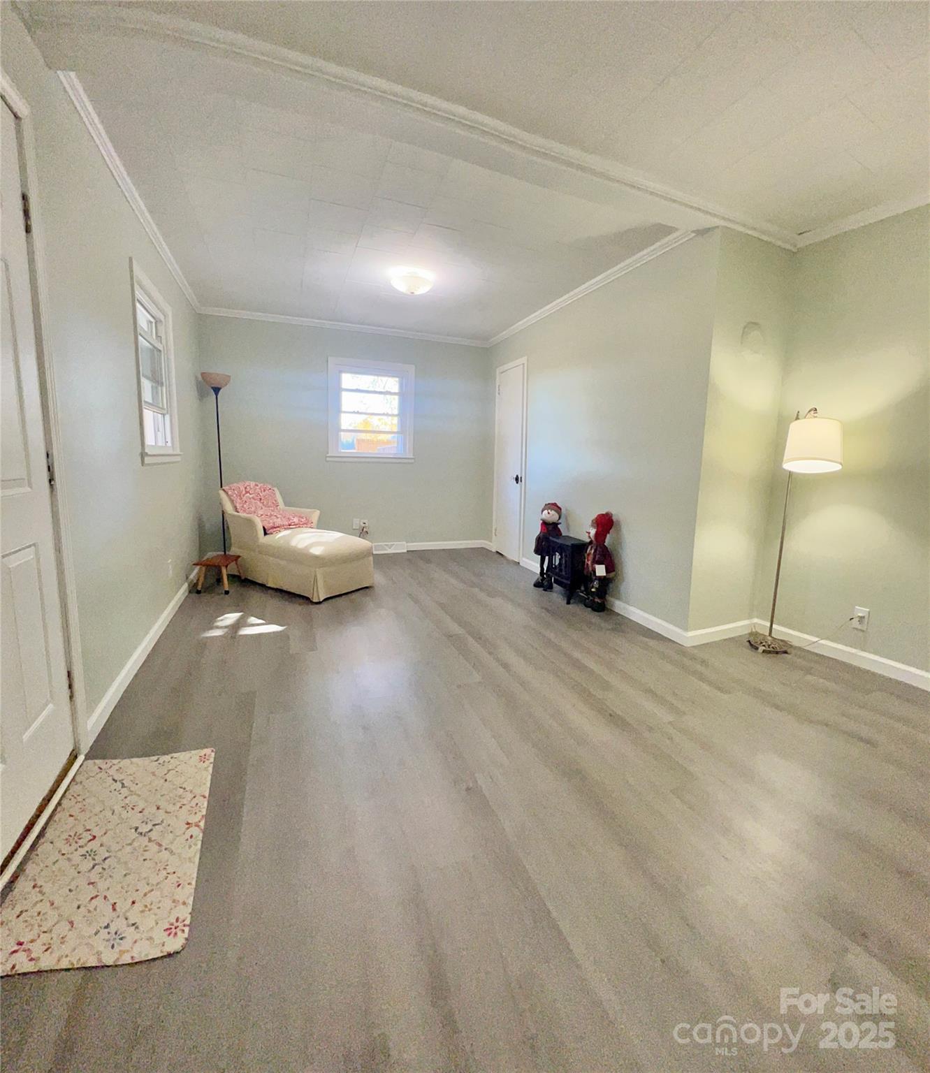 240 Hamrick Road Mooresboro, NC 28114 - Photo 9 of 23 a living room with furniture and a lamp