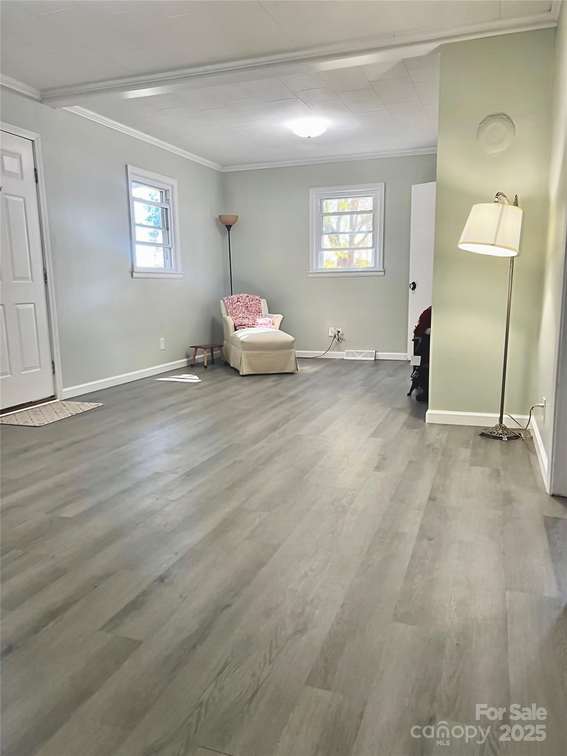 240 Hamrick Road Mooresboro, NC 28114 - Photo 10 of 23 a view of a livingroom with wooden floor and window