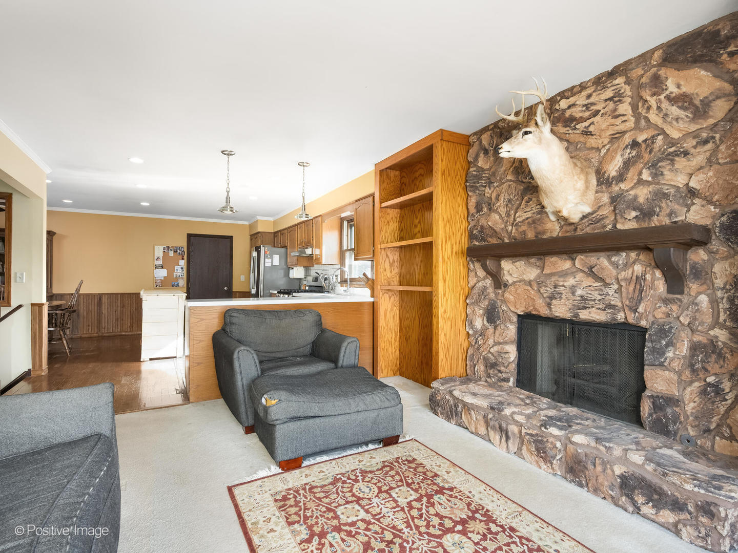 130 West End Road Roselle, IL 60172 - Photo 11 of 27 a living room with furniture a fireplace and a table