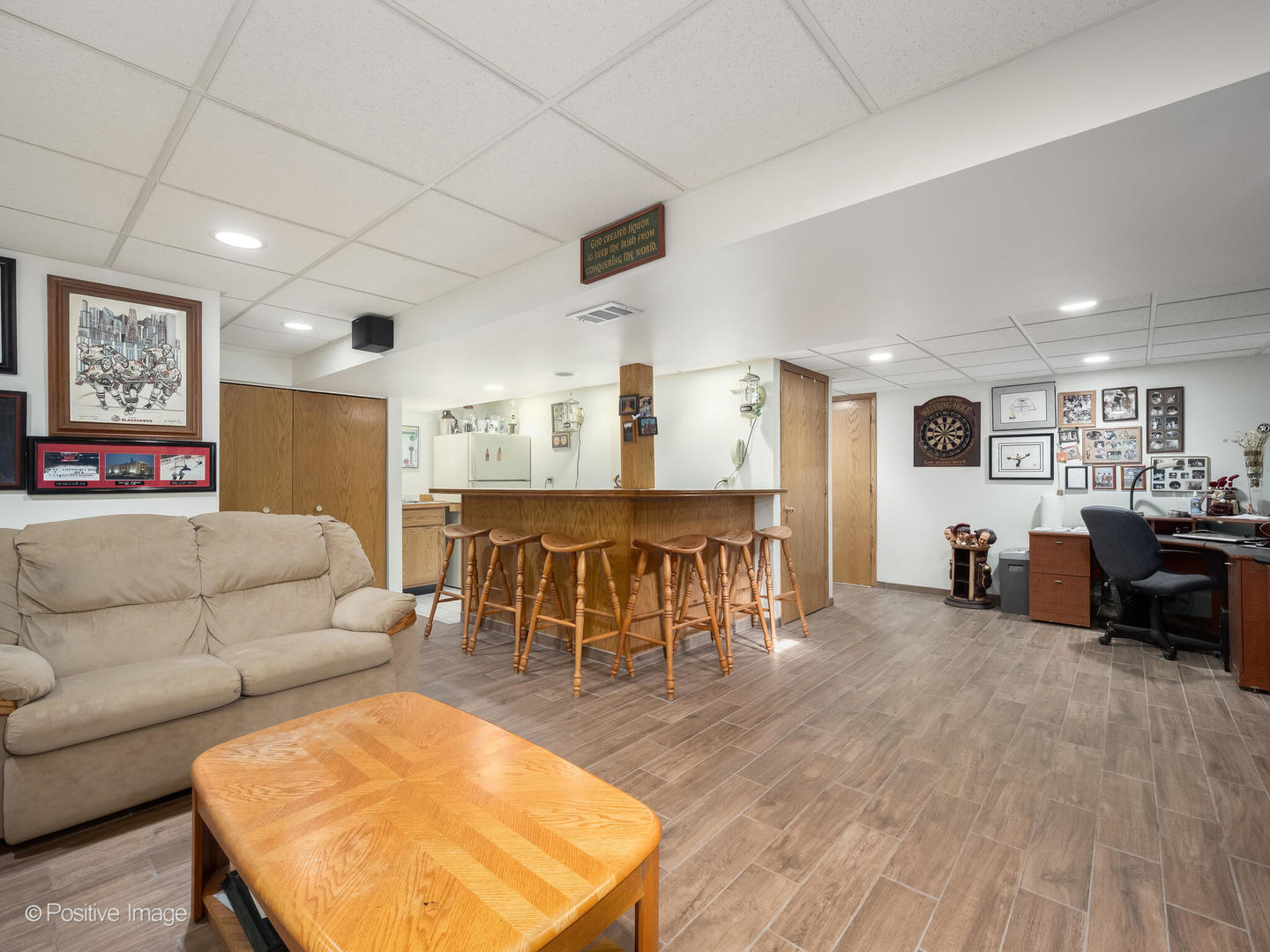 130 West End Road Roselle, IL 60172 - Photo 18 of 27 a living room with furniture and a dining table with kitchen view