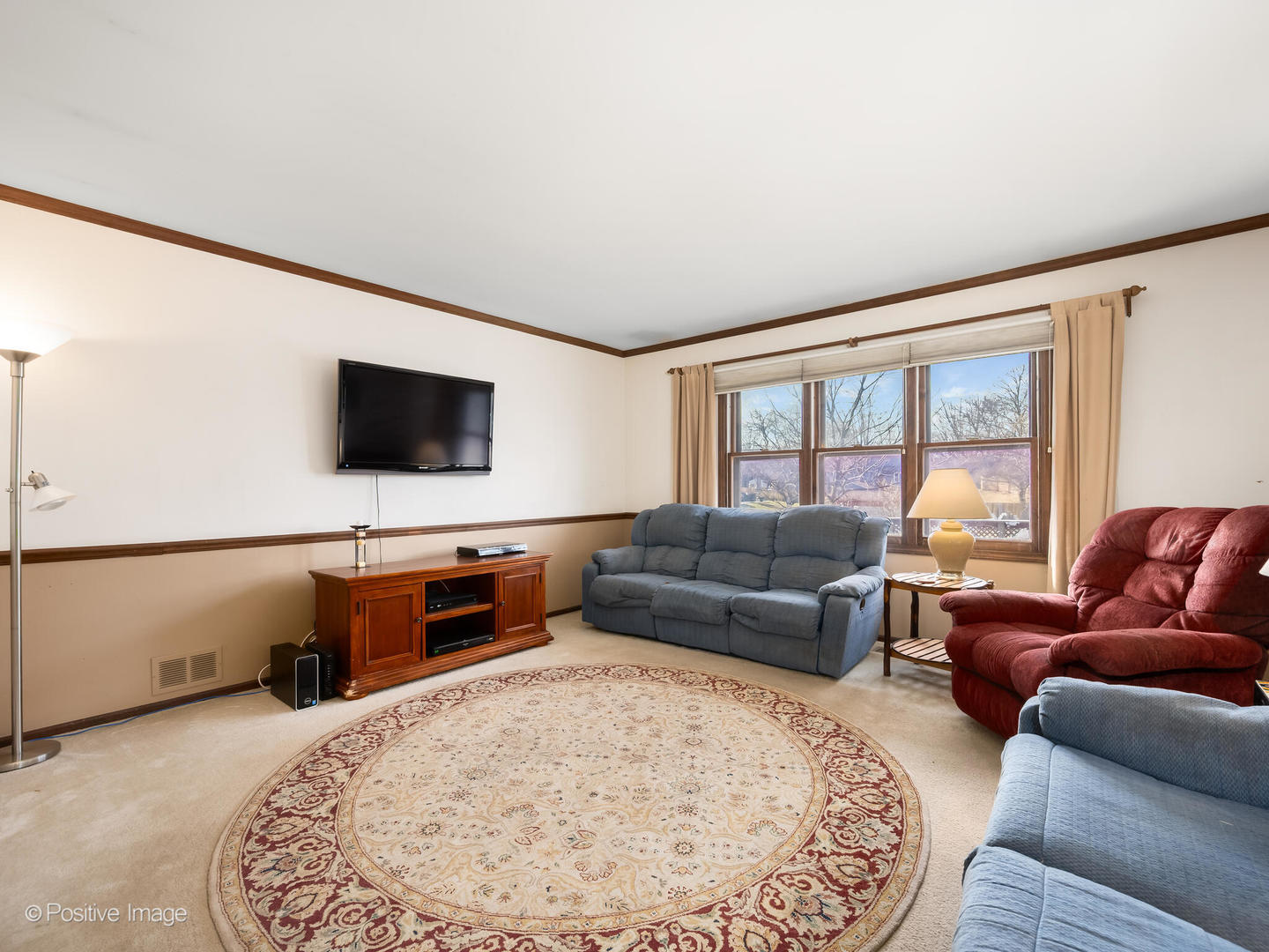 130 West End Road Roselle, IL 60172 - Photo 4 of 27 a living room with furniture and a flat screen tv