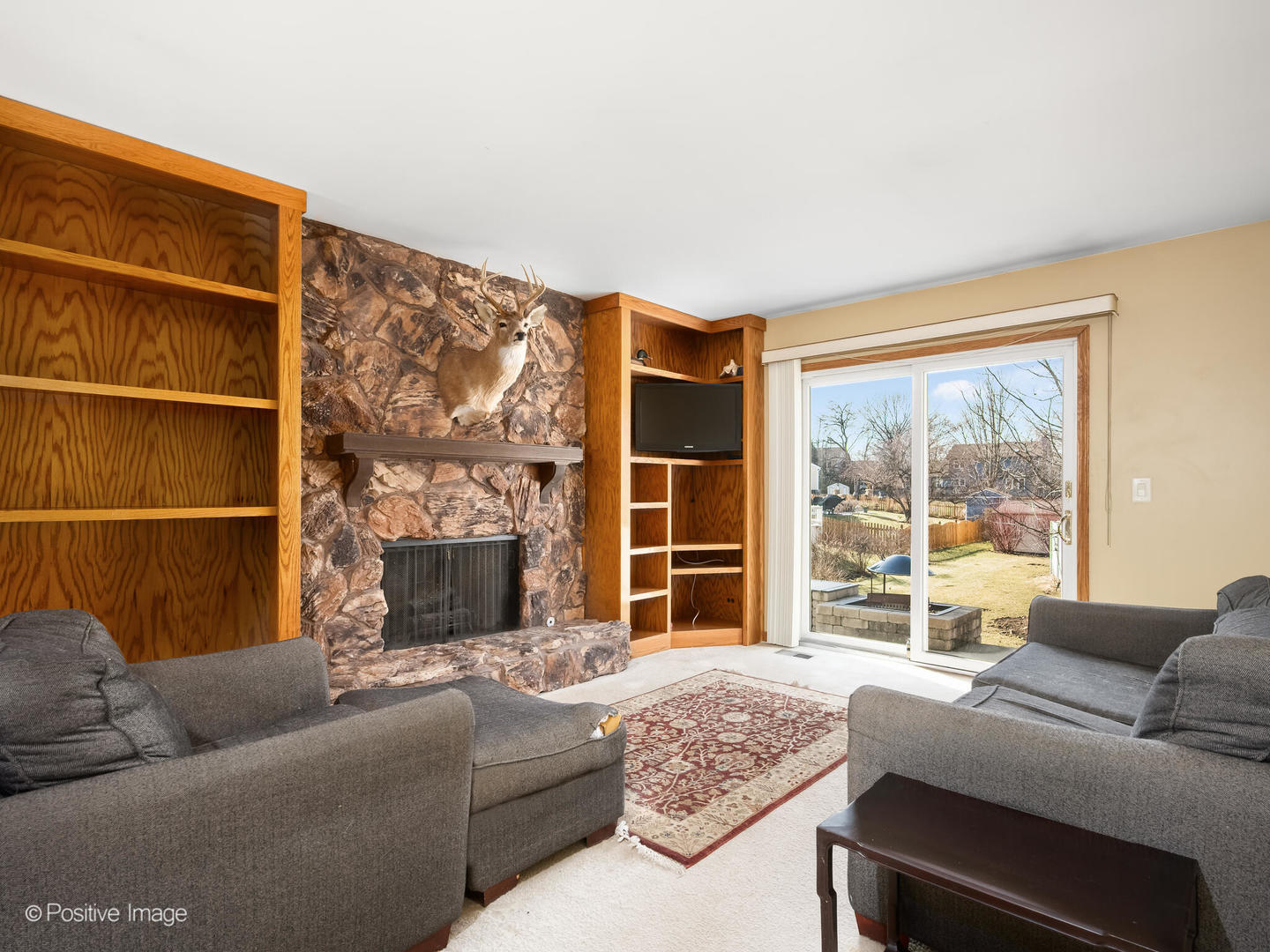 130 West End Road Roselle, IL 60172 - Photo 10 of 27 a living room with furniture and a large window