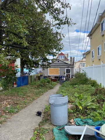 a front view of house with yard and trees