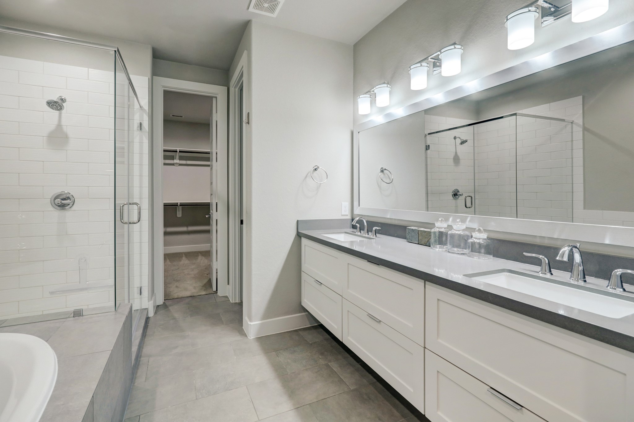 4203 Allen Street Houston, TX 77007 - Photo 25 of 35 a bathroom with a granite countertop sink double vanity and shower