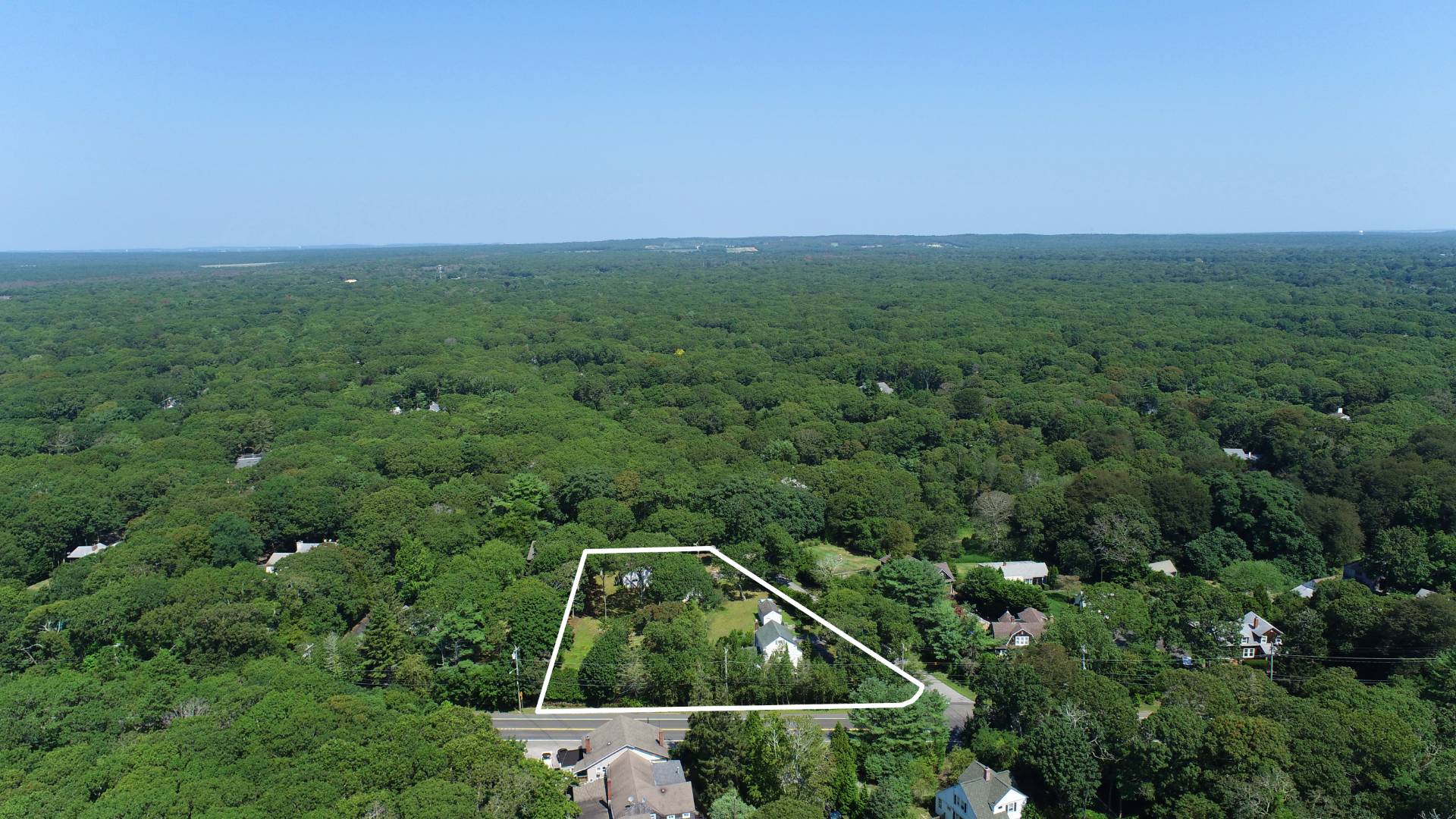 39 Foster Road Quogue, NY 11959 - Photo 2 of 13 a view of a field with a tree