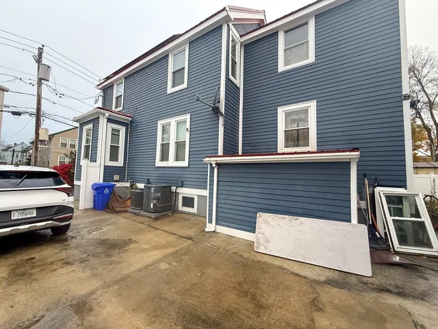 a view of a car park in front of house