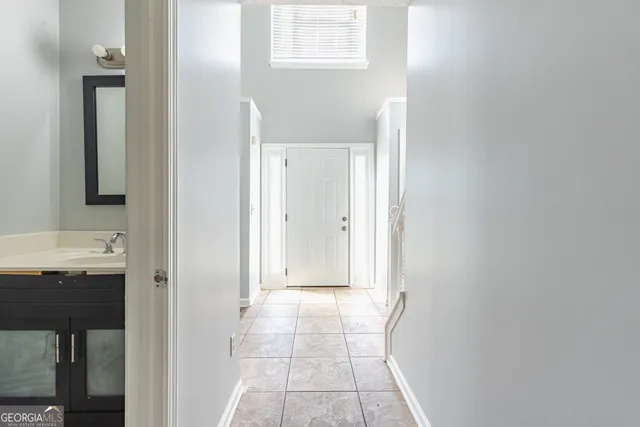 a view of a bathroom from a hallway