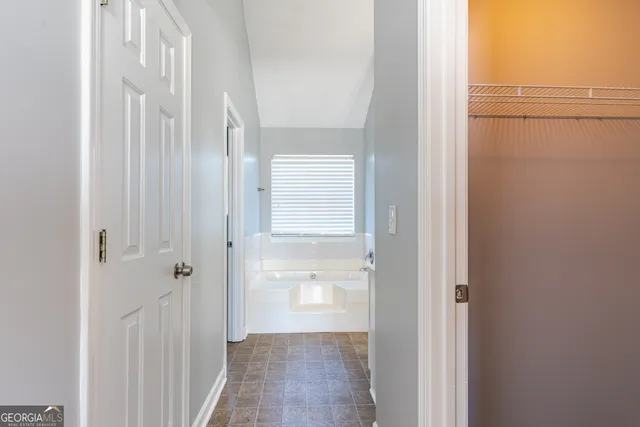 a view of a bathroom from a hallway