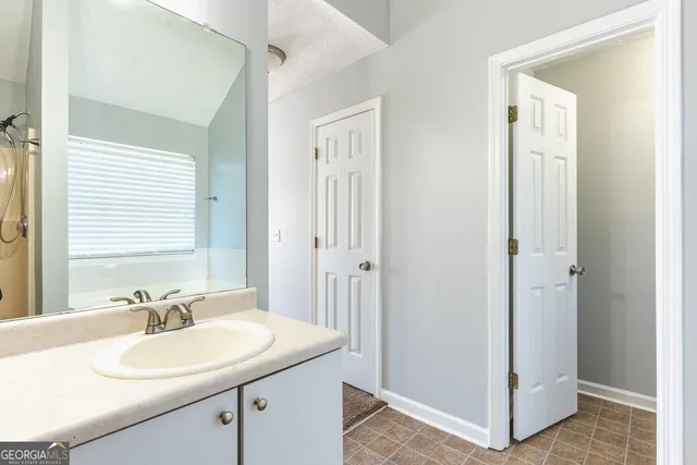 a bathroom with a sink and a mirror