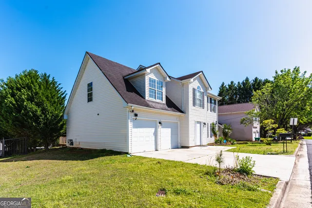 a front view of a house with a yard