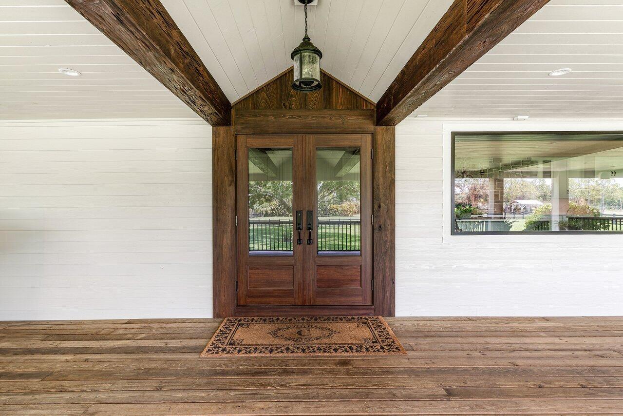 17270 Rocky Pines Road Jupiter, FL 33478 - Photo 19 of 69 a view of a door of the house