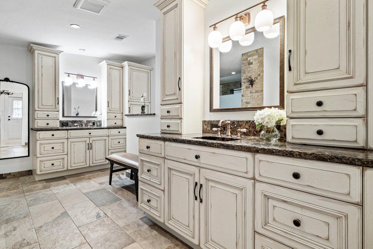 17270 Rocky Pines Road Jupiter, FL 33478 - Photo 23 of 69 a spacious bathroom with a granite countertop sink mirror and