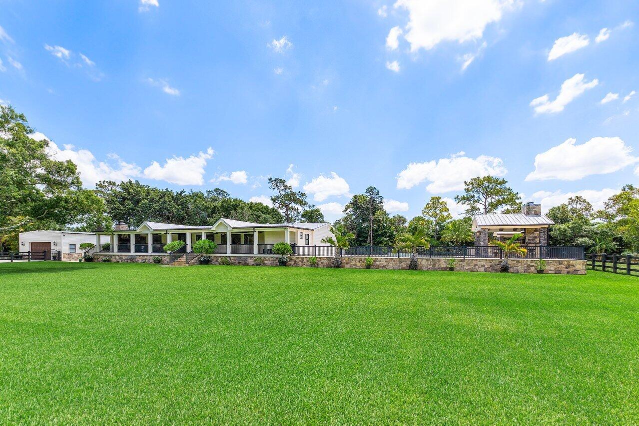 17270 Rocky Pines Road Jupiter, FL 33478 - Photo 46 of 69 a view of a house with a big yard