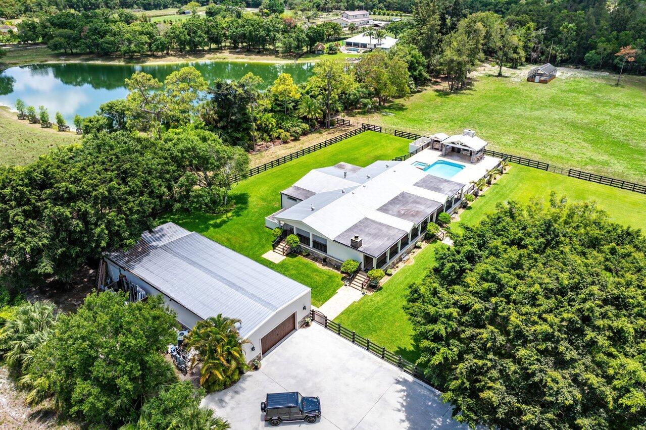 17270 Rocky Pines Road Jupiter, FL 33478 - Photo 61 of 69 an aerial view of a house with garden space and street view