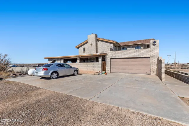a kitchen with stainless steel appliances granite countertop a refrigerator a stove and a sink with cabinets