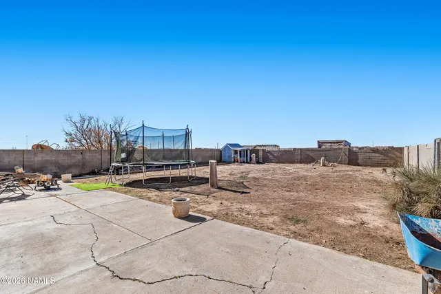 a bedroom with a bed and a dresser in it