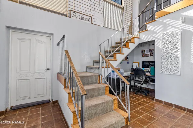 a bedroom that has a bed and a table in it