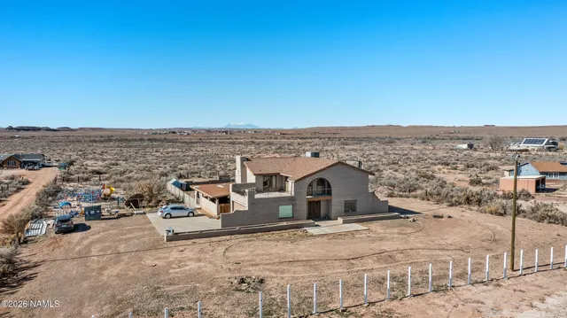 a view of a car parked in front of a house