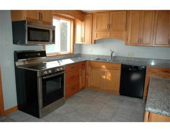 32 Mine Road Westhampton, MA 01027 - Photo 5 of 24 a kitchen with stainless steel appliances granite countertop a stove a sink and a microwave