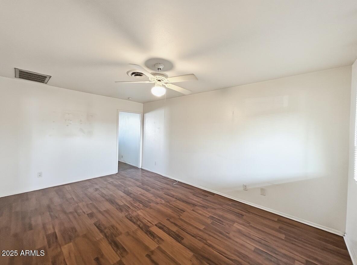 513 East Hatcher Road, Unit 9 Phoenix, AZ 85020 - Photo 6 of 10 wooden floor in an empty room