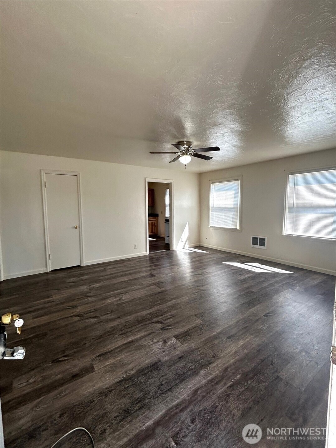 2914 Washington Way Longview, WA 98632 - Photo 4 of 17 an empty room with wooden floor and windows