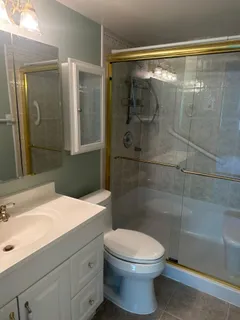 a view of a swimming pool with a table and chairs