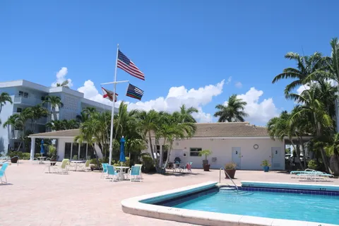 a view of a lake with boats and trees in the background