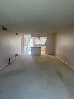 a kitchen with stainless steel appliances granite countertop a refrigerator a stove a sink and dishwasher