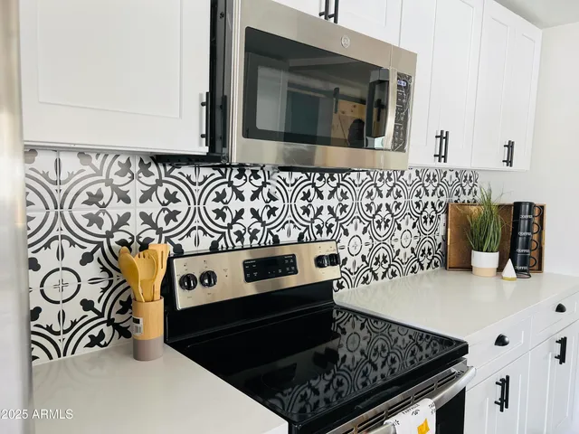 a kitchen with a stove and a microwave