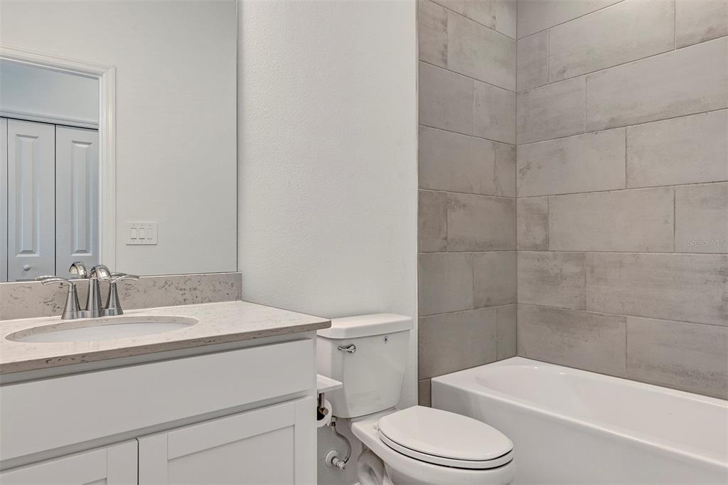 19438 Southwest 79th Street Dunnellon, FL 34432 - Photo 13 of 34 a bathroom with a sink toilet and shower