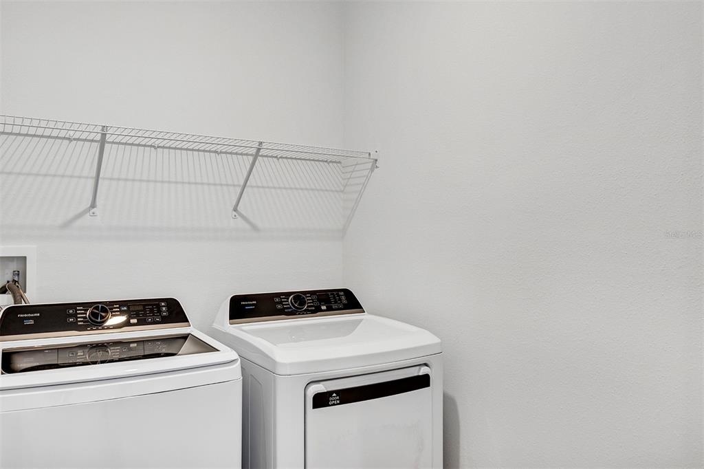 19438 Southwest 79th Street Dunnellon, FL 34432 - Photo 18 of 34 a utility room with dryer and washer