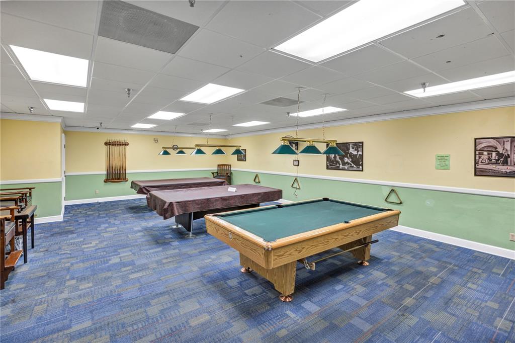 19438 Southwest 79th Street Dunnellon, FL 34432 - Photo 26 of 34 a room with pool tables and windows