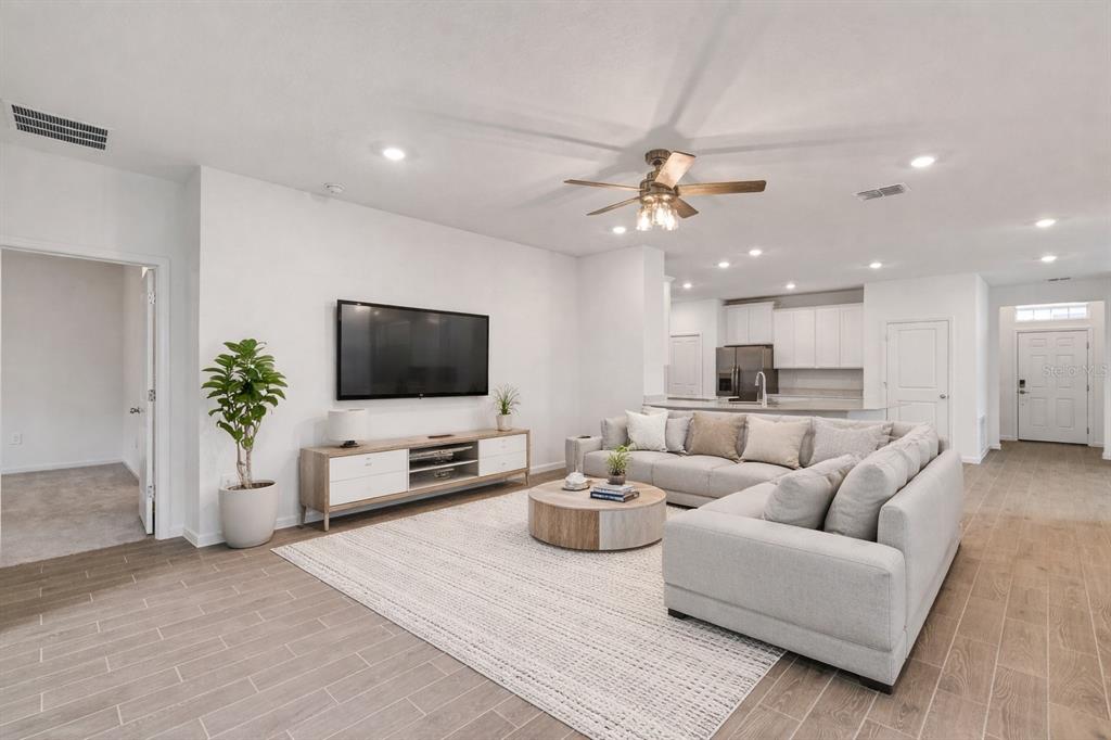19438 Southwest 79th Street Dunnellon, FL 34432 - Photo 5 of 34 a living room with furniture and a flat screen tv