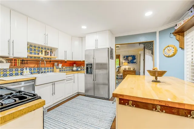 a view of a dining room with furniture wooden floor and chandelier