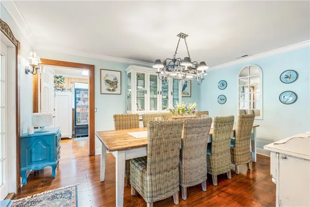a bathroom with a granite countertop double vanity sink and a mirror