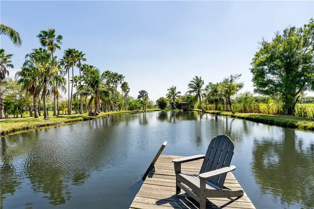 a view of a patio with table and chairs and wooden floor
