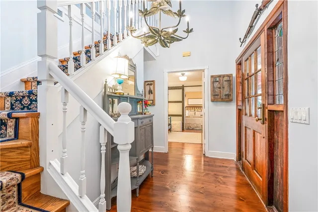 a living room with furniture fireplace and a large window