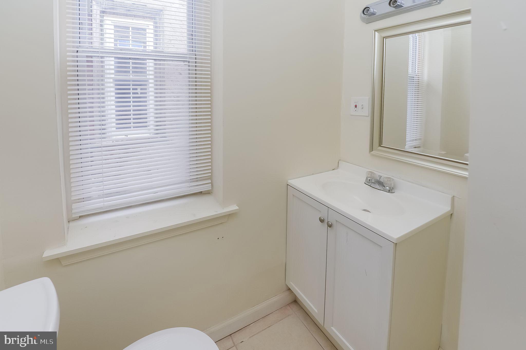 3733 North 15th Street, Unit 2 Philadelphia, PA 19140 - Photo 12 of 12 a bathroom with a sink and a toilet